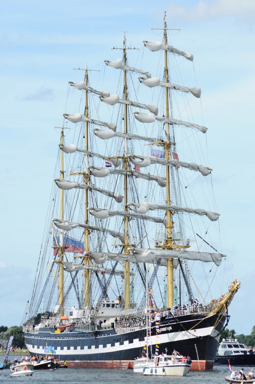 a large black and white ship in a harbor