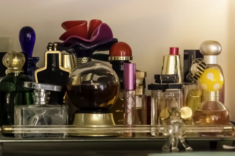 several types of perfumes and an elephant statue