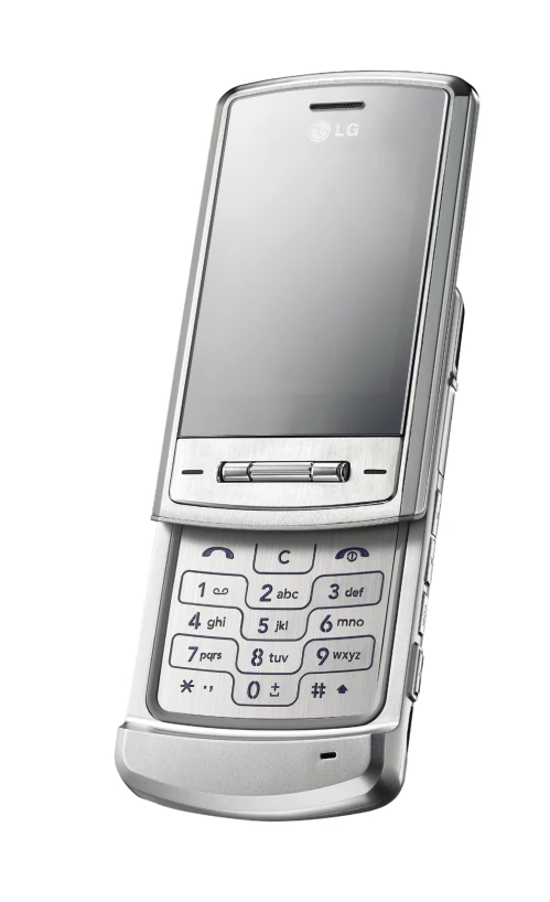 a silver cell phone on top of a white surface