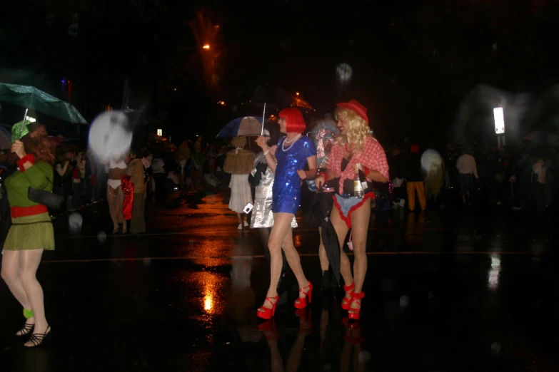 three woman dressed in red and white umbrellas are walking around the city