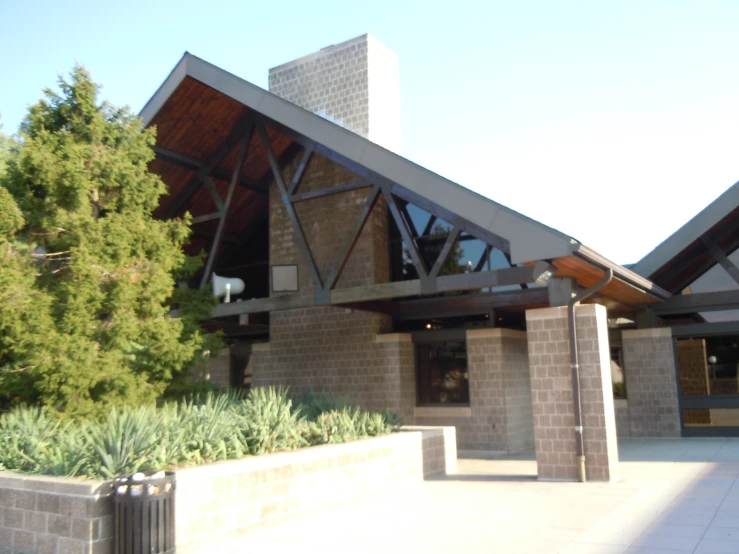 a very large brick building with an outdoor entertainment center