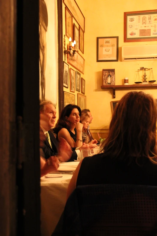 a group of people that are sitting around a table