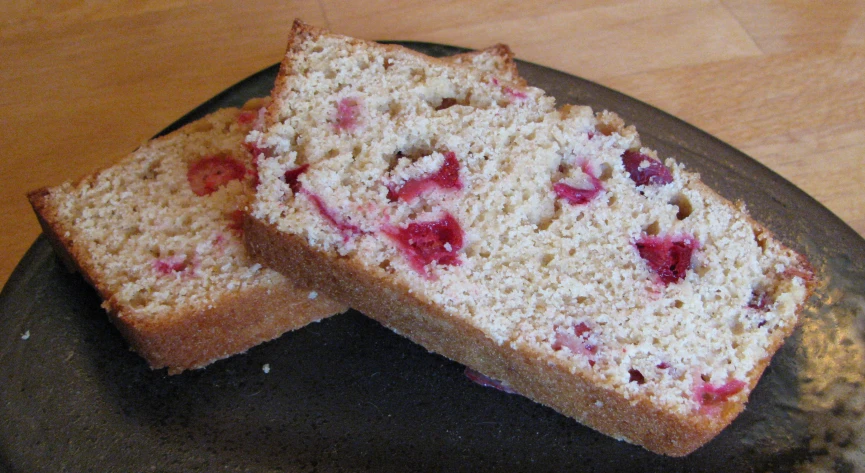 a couple slices of cake sitting on top of a metal pan