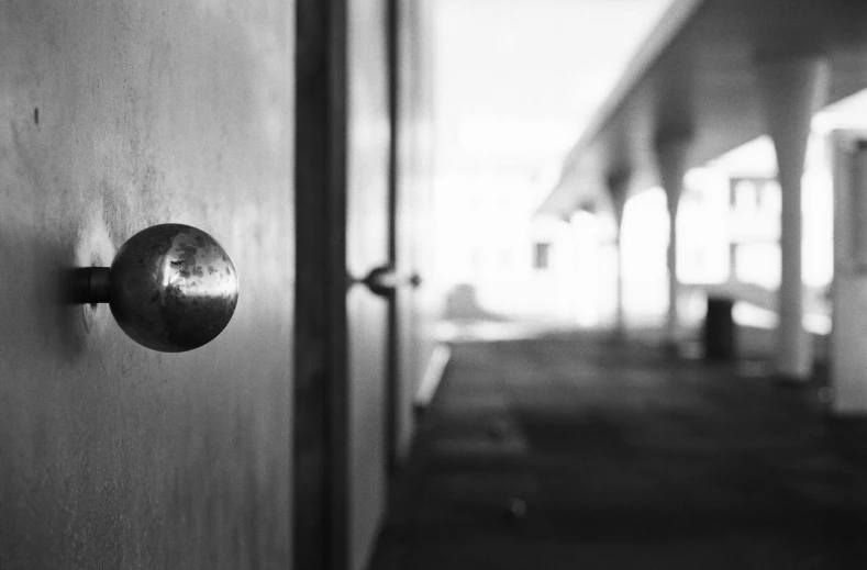 the door handle on a wooden building is shown