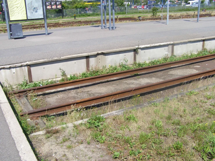 there is a train on the tracks beside a platform