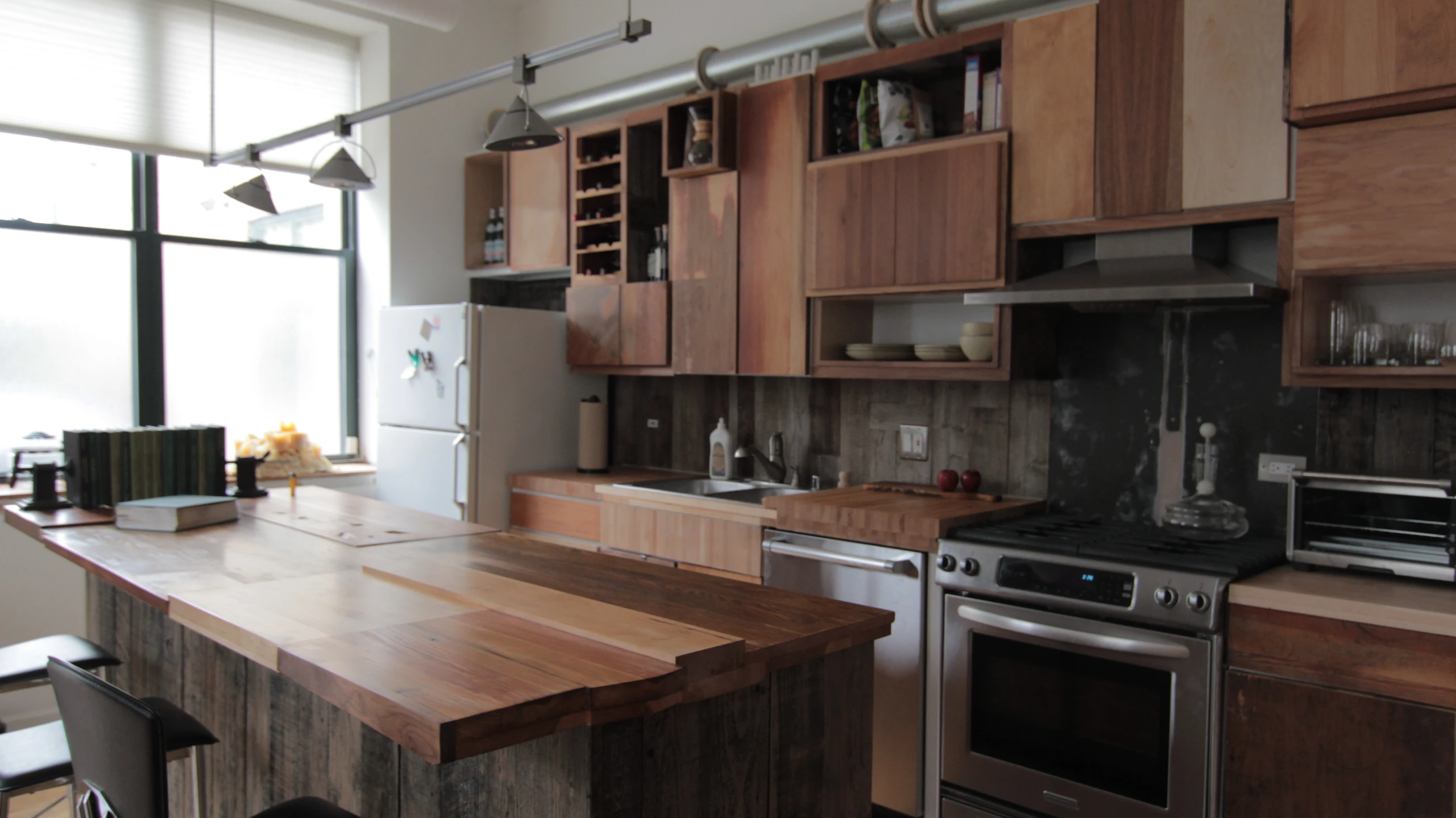 there is a sink in the middle of the kitchen