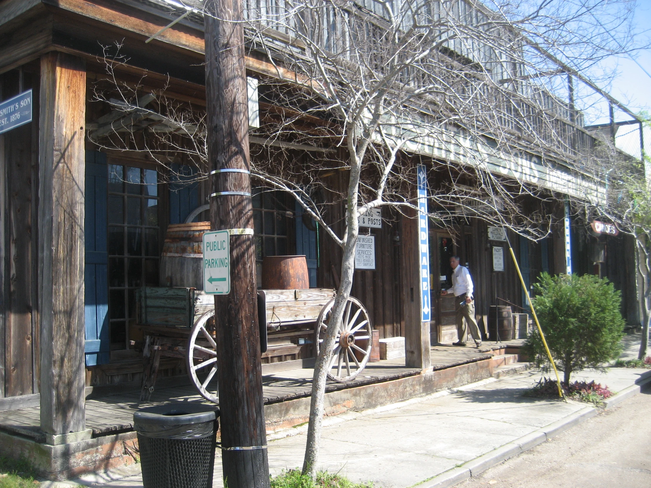 people walking past an old looking store