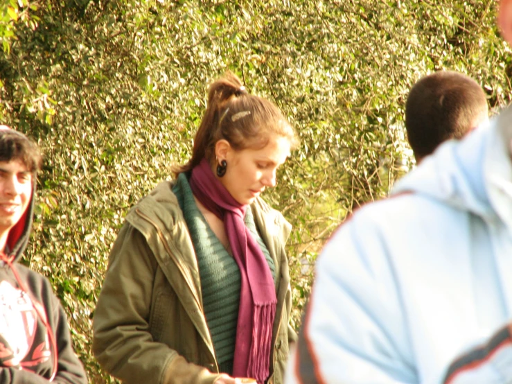 a lady walking past another group of people