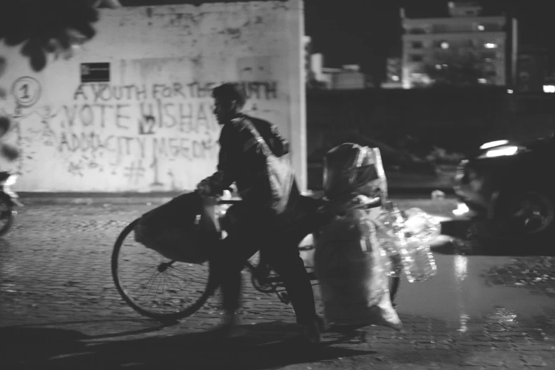 black and white po of people riding a bicycle