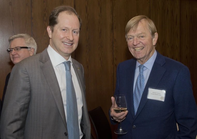 a couple of men standing next to each other