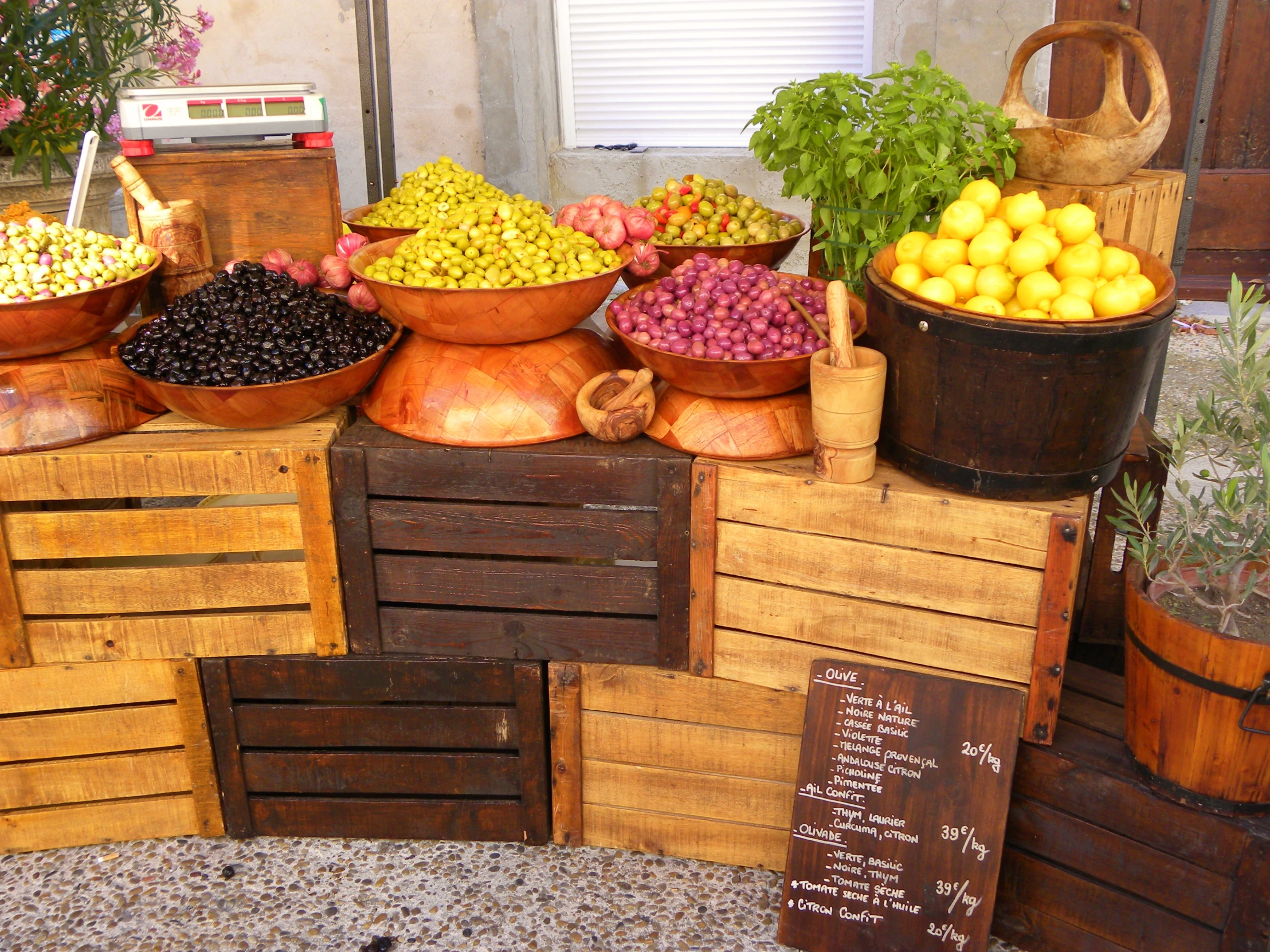 various bowls of fruit and vegetables sit on display