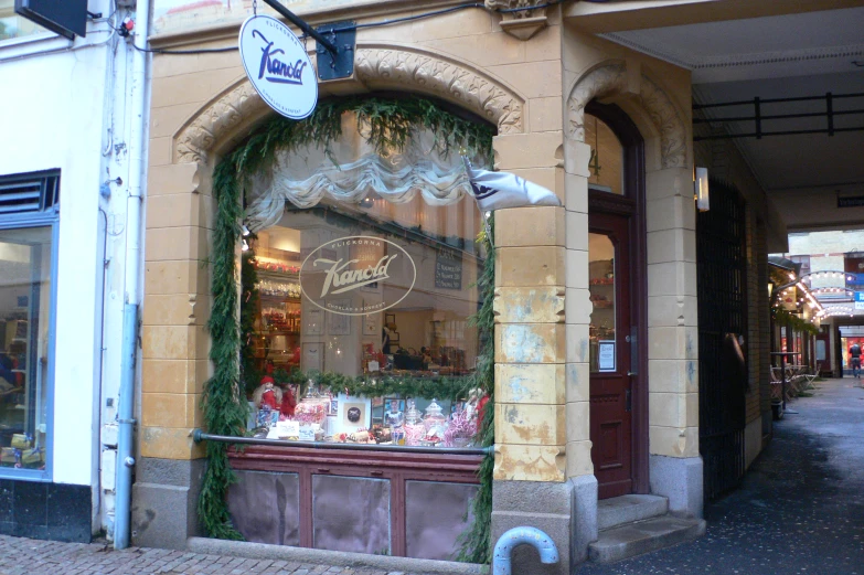 a bakery in a european city, decorated for christmas