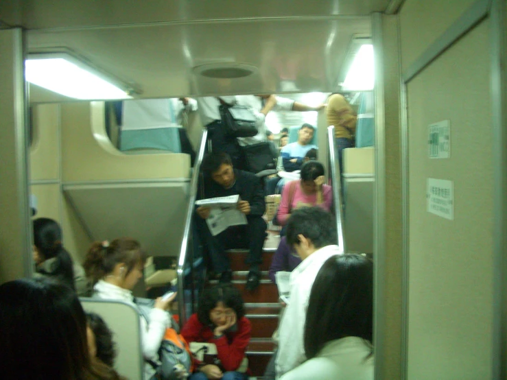 a bunch of people on a train traveling by