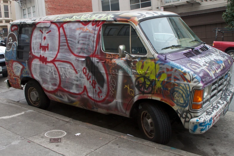 the van has many graffiti on it's side