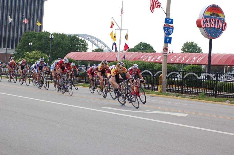 a group of people riding bikes down the road