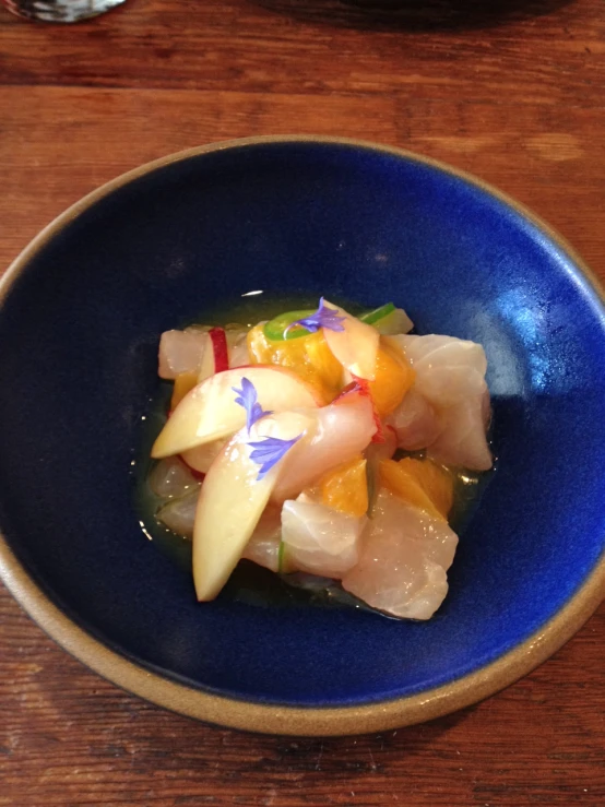 an assortment of vegetables in a blue bowl