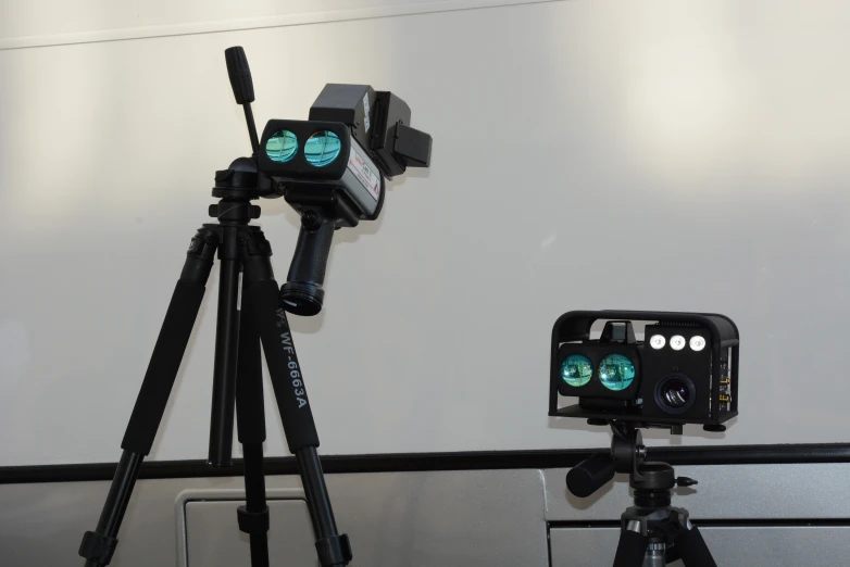 two lights in front of a camera in a room