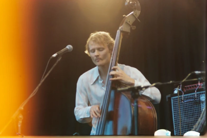 an image of a man that is playing the guitar