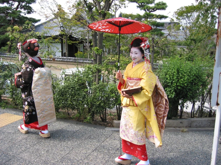 two women in traditional japanese dress walking together