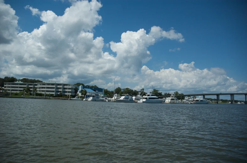 a body of water with some boats out front