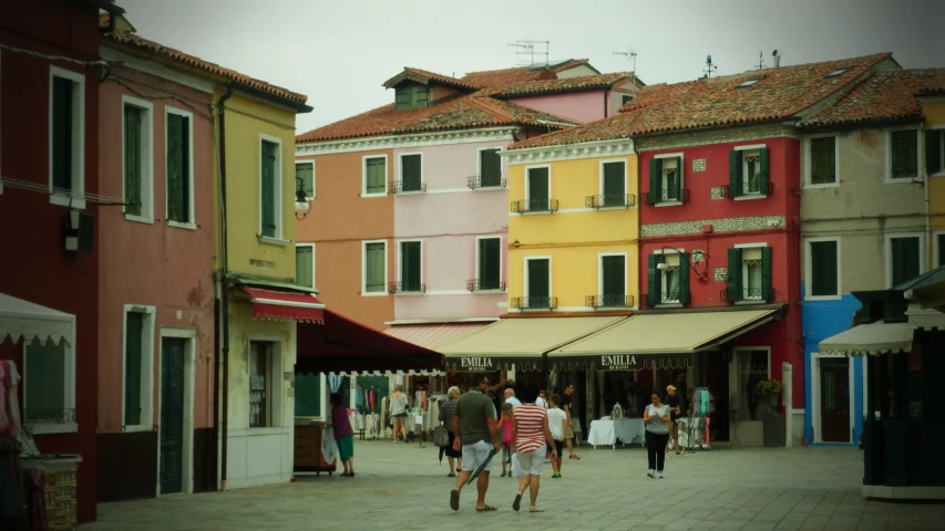 several people walk around an area that has been multi - colored