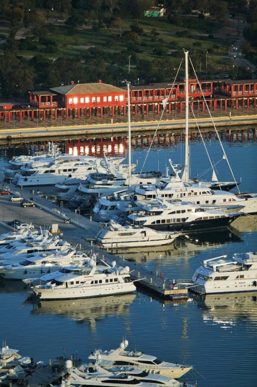 an aerial view of the water and many boats