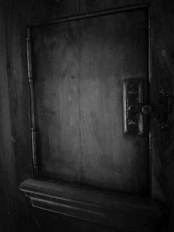 black and white pograph of a wooden door