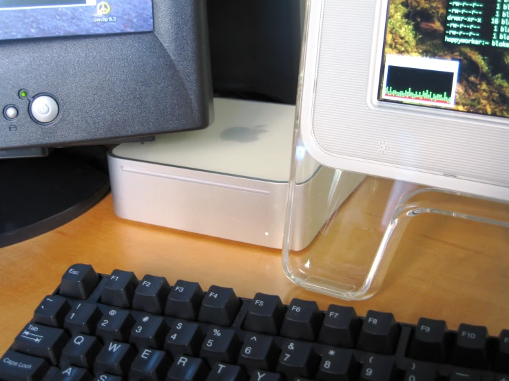 a desktop computer sitting on top of a wooden desk