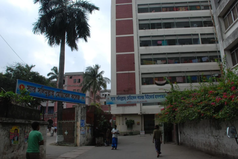 a  walking on the street in front of buildings