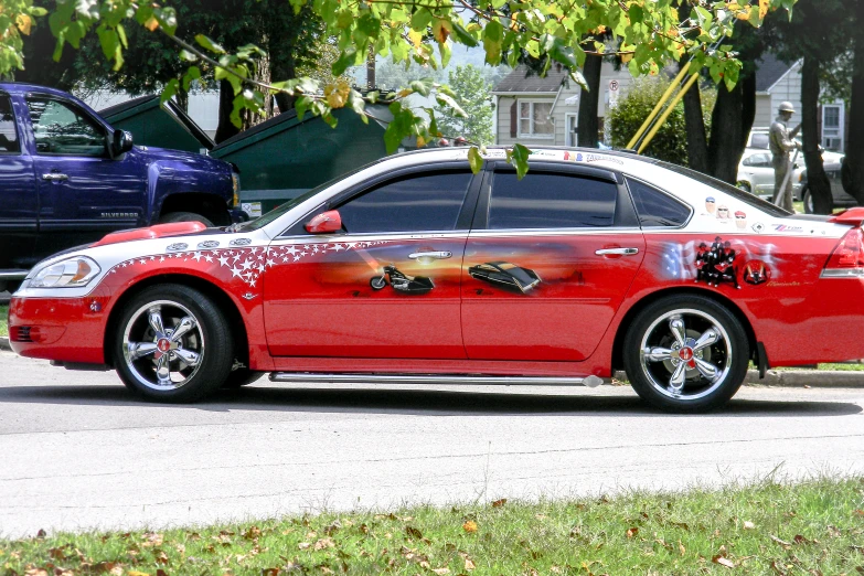 the red sports car has a dragon on it