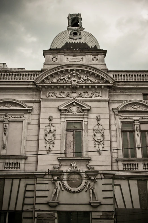 a building has many arched windows and a clock