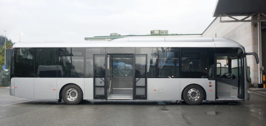 a large bus parked in front of a building