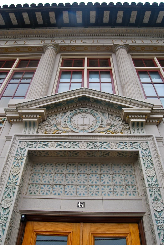 an ornate facade on a building with carved wooden doors