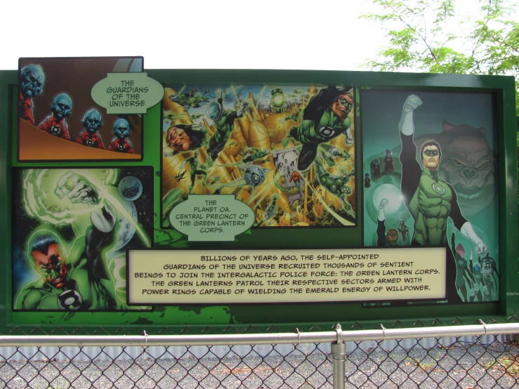 a large poster about green lantern in a park