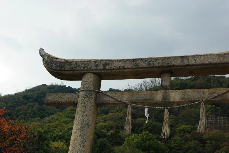 an ancient stone shrine on a hill side