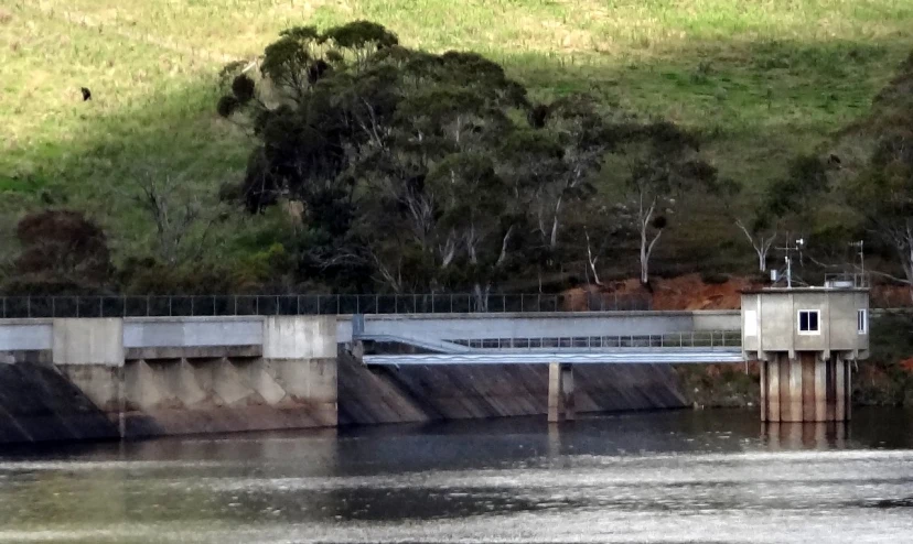 a concrete bridge on top of a lake