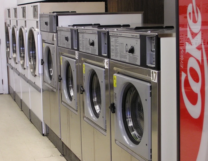 washers in a row and signs above them telling about water quality