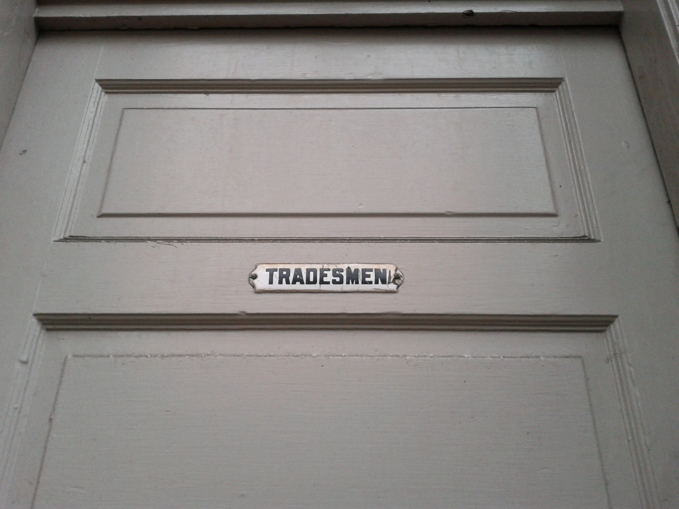 a door is decorated with a sign that reads trade menu