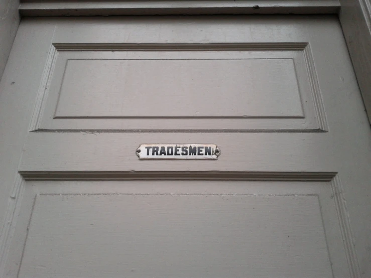 a door is decorated with a sign that reads trade menu