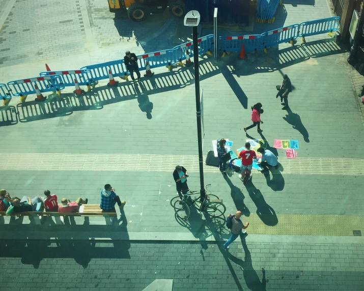 people walking and riding bikes on street near road