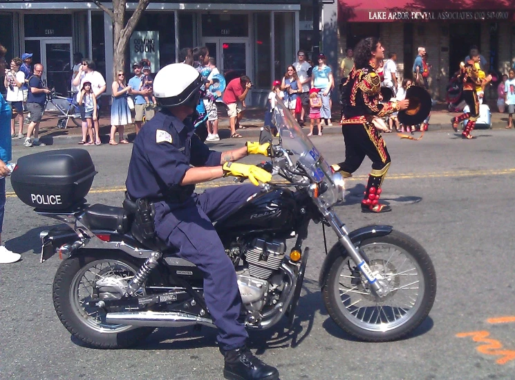 a police officer is riding a motorcycle on the street