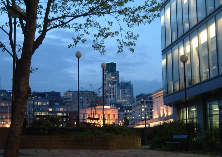 a cityscape is reflected in the buildings of an urban area
