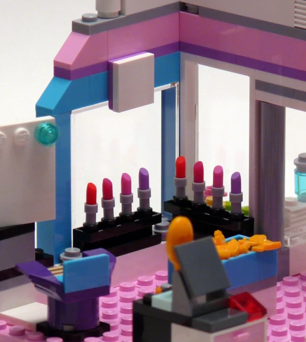 a large lego building with lipstick in the shop