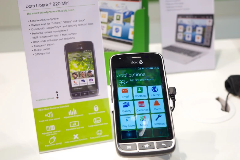 a close up of two smart phones on display at an exhibition