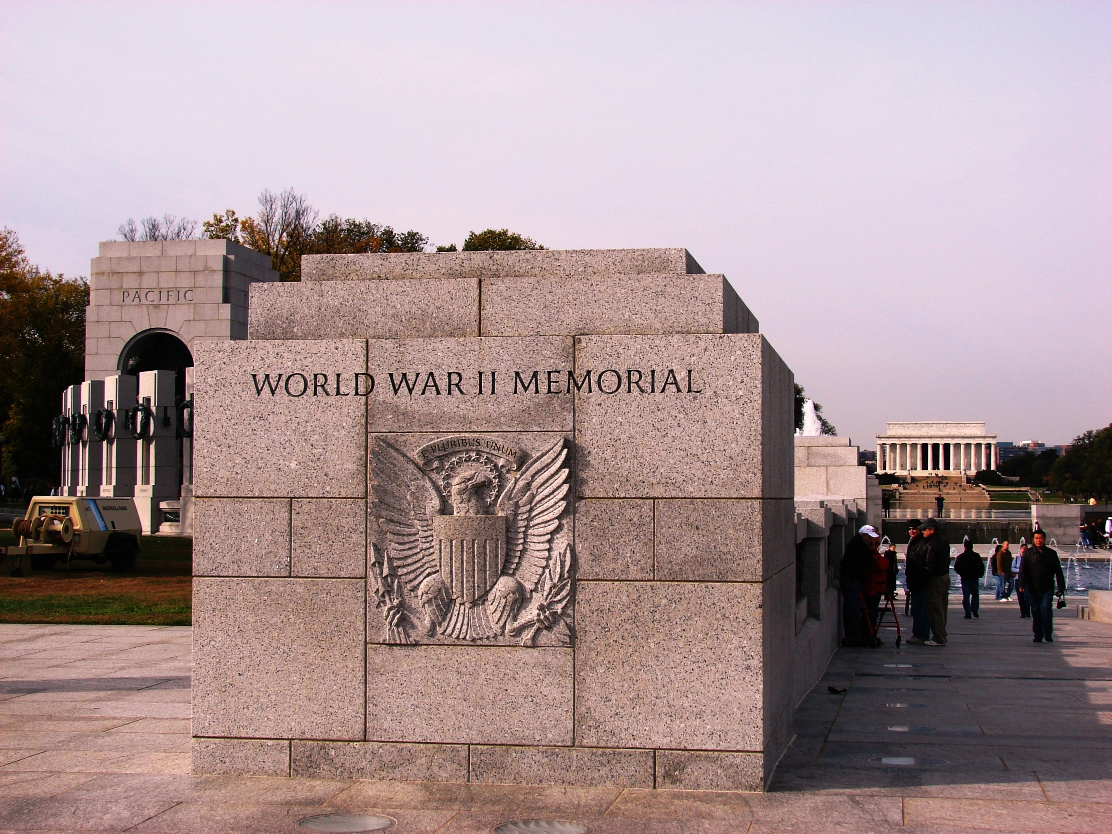 people are walking by a monument with the inscription world war i memorial