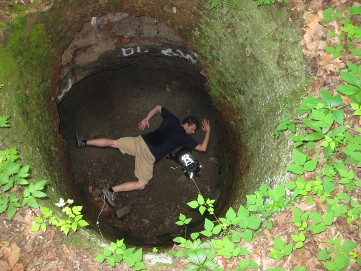 a young man who is laying down in the ground