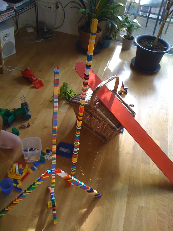 a  is playing with colored construction pieces