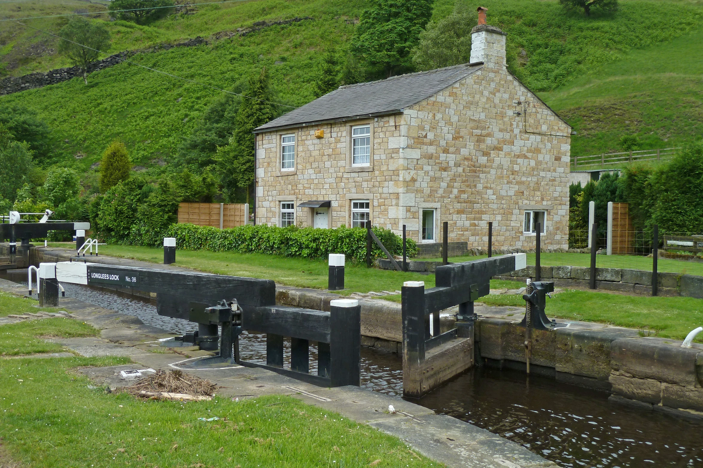 a couple of stone buildings and a small canal