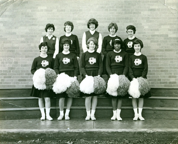 black and white po of girls in cheer uniforms