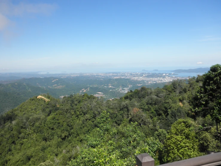 the view out from atop the hills looking down on a city